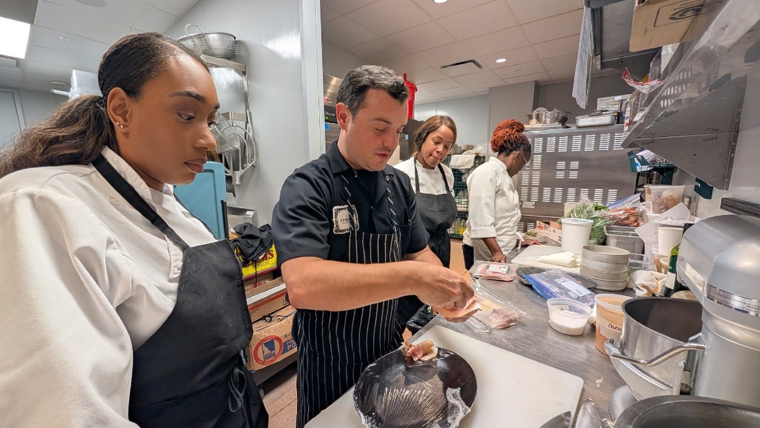 Chef David Cordúa demonstrates a technique to fold Italian ham prosciutto to HCC Culinary Arts students during Houston Restaurant Weeks at The Lymbar restaurant.