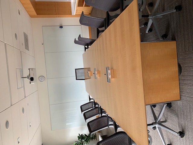 Closer photo of the deskspace and chairs in the Arctic Ocean Conference room