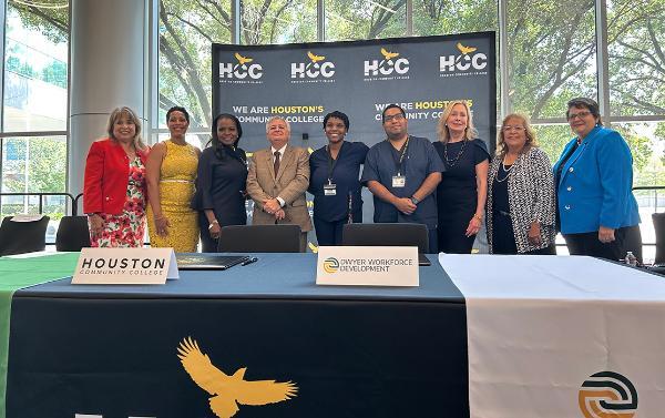 Representatives from Houston Community College and Dwyer Workforce Development stand together after the Memorandum of Understanding signing.