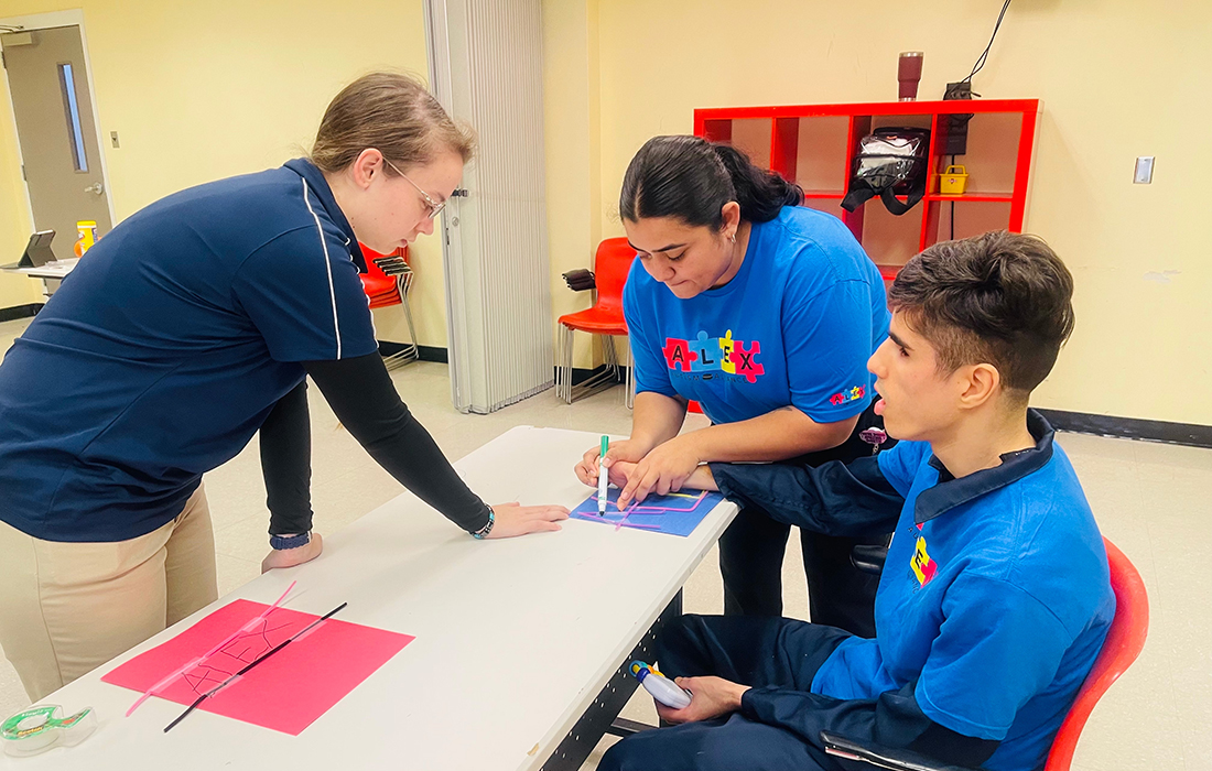 HCC Occupational Therapy Assistant students help participant Alexandre Santos sign in to the program session.